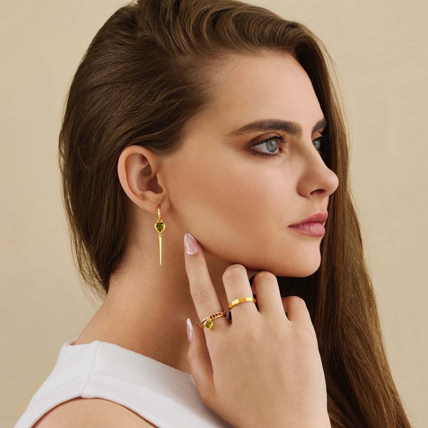 Peridot gemstone heart hoop drop earrings and ring on model
