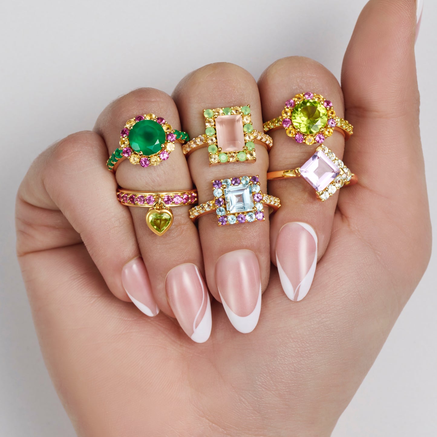 multi gemstone colourful cocktail rings on models hand
