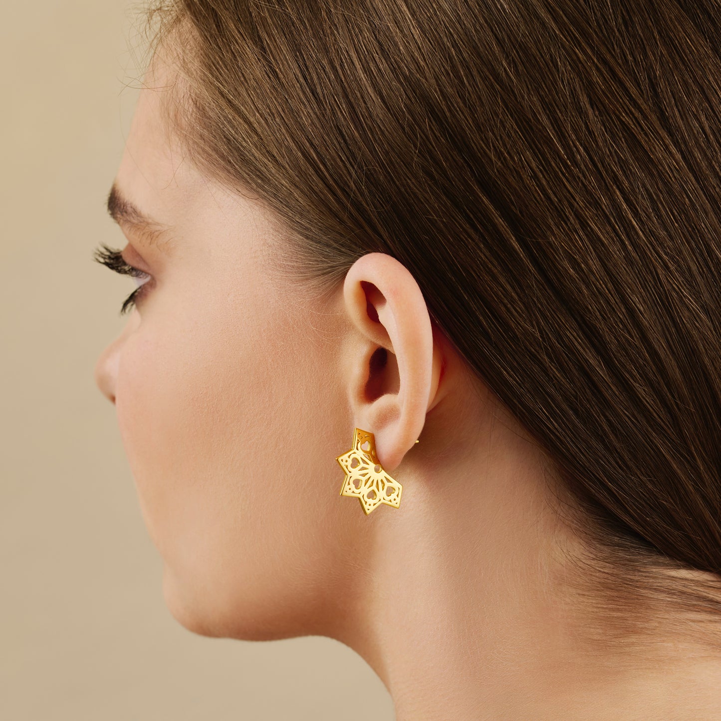 Heart flat fan style hoop earrings in gold vermeil close up on model