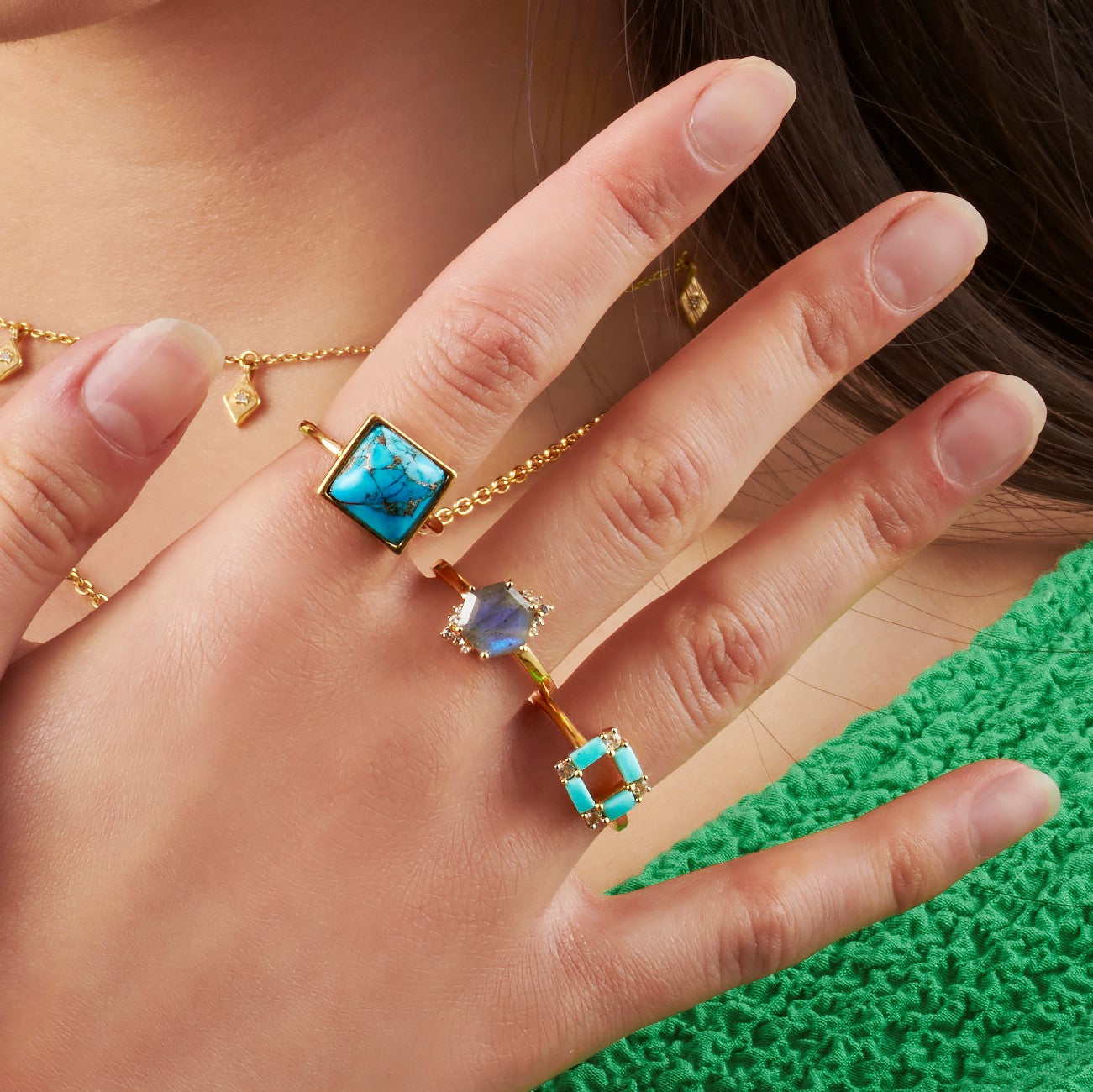 blue gemstone rings on hand